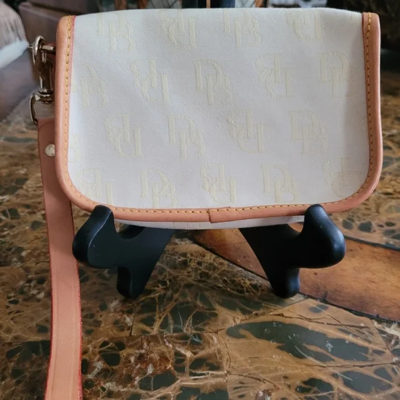 Dooney and Bourke Elegant Cream and Tan Women's pouch - Picture 2 of 4